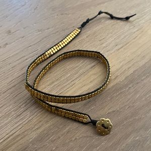 Gold beaded wrap bracelet.